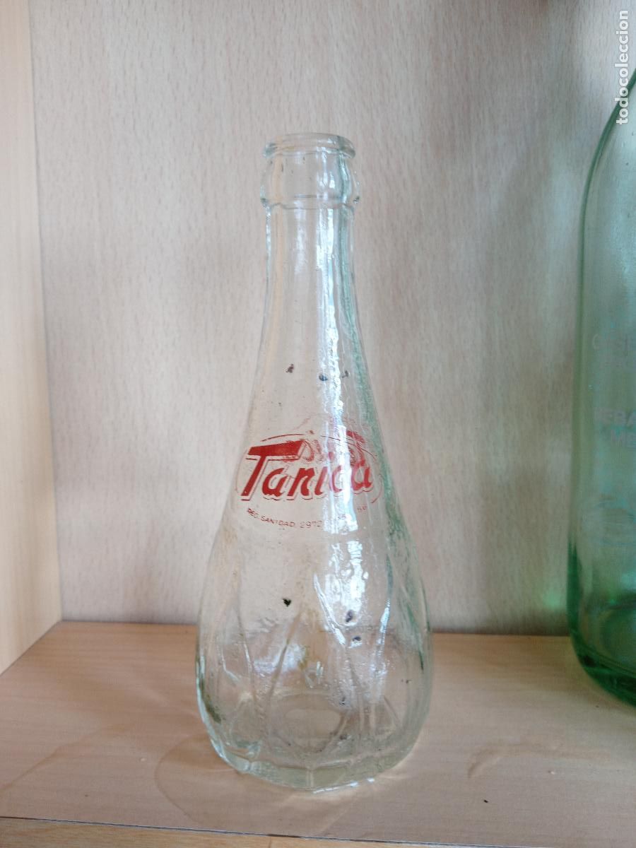 Botellas antiguas: BOTELLA RELIEVE Y SERIGRAFIA TANICA - Foto 1