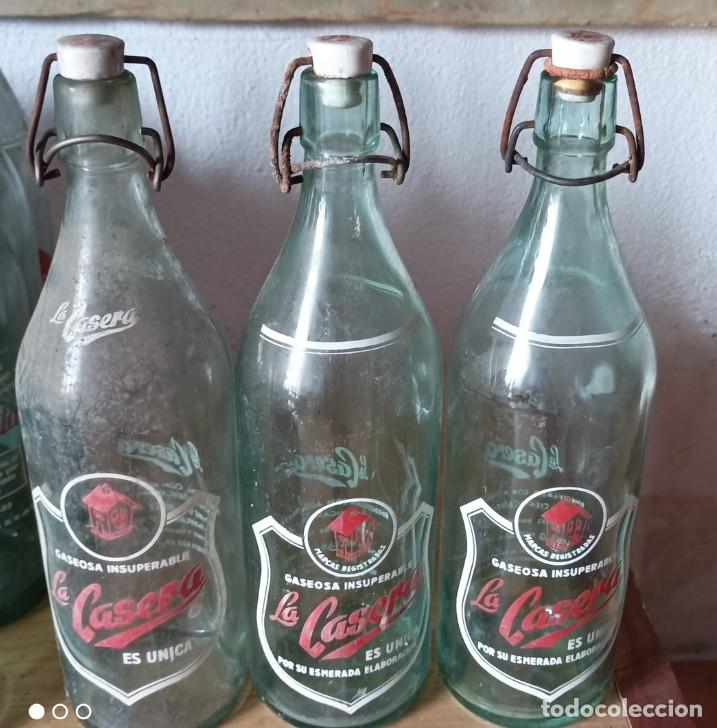Botellas antiguas: BOTELLAS DE GASEOSA LA CASERA - Foto 1