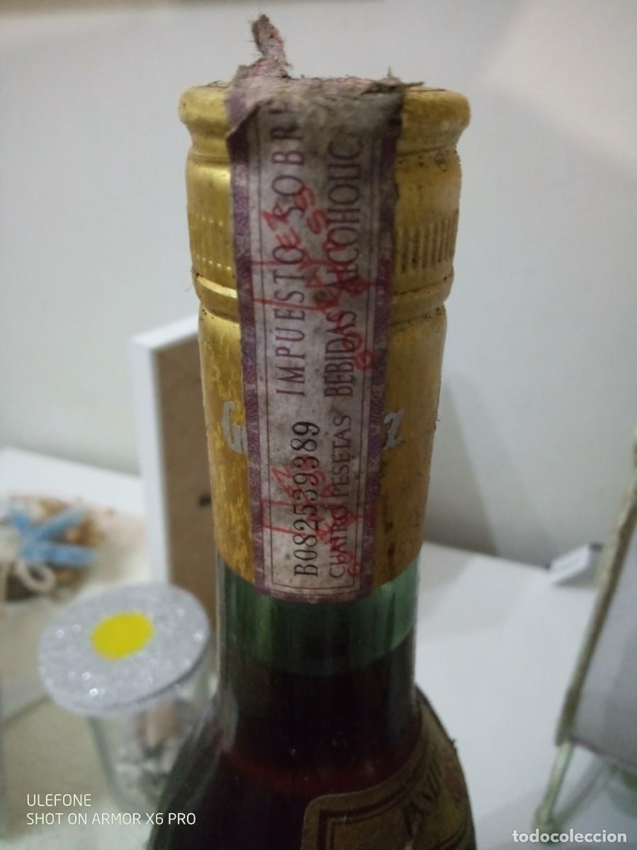 Botellas antiguas: botella brandy Insuperable - Foto 1