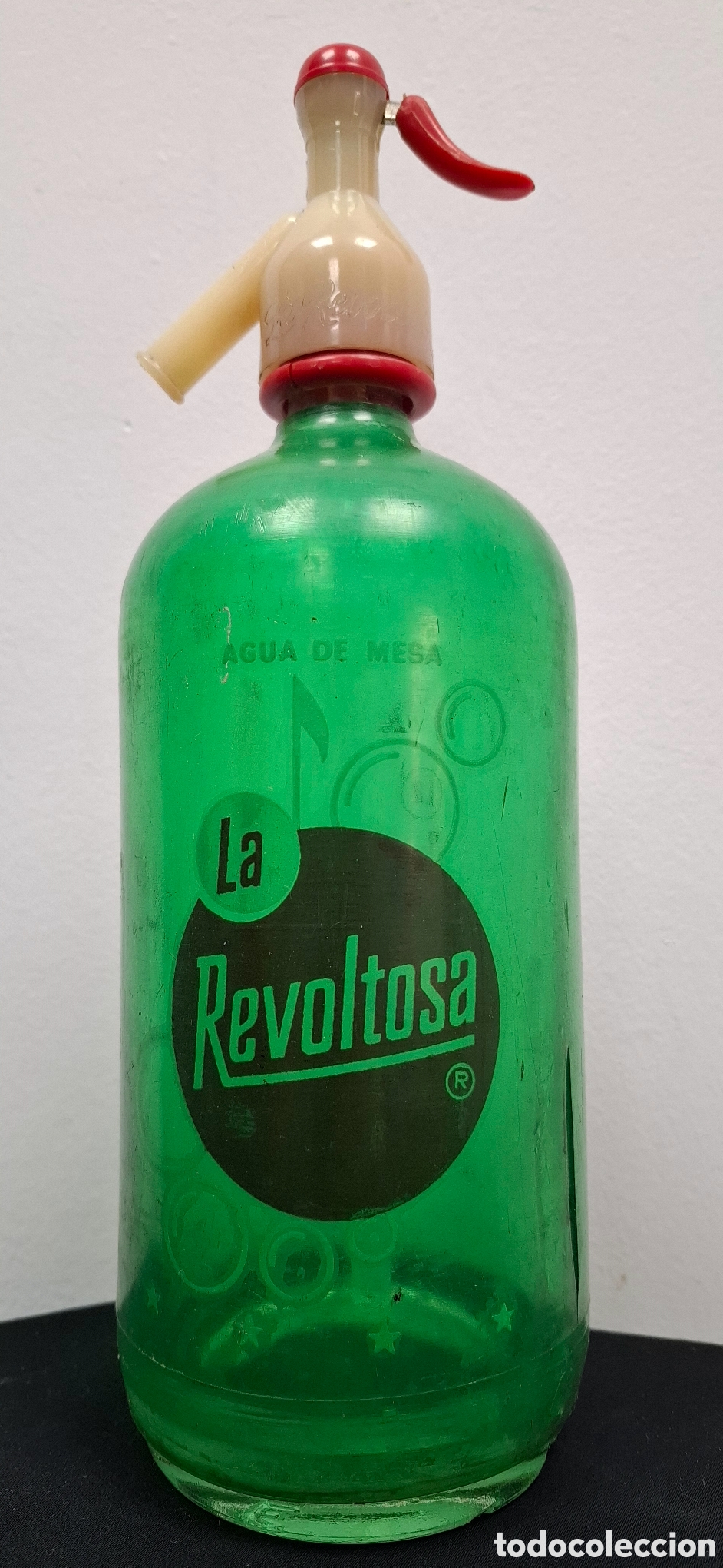 Botellas antiguas: Sif&oacute;n la Revoltosa con funda - Foto 1