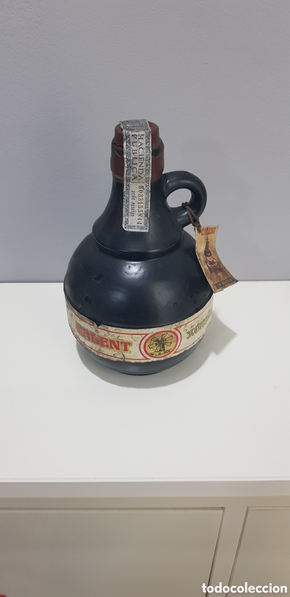 Botellas antiguas: Botella llena calent xoriger con precinto - Foto 1