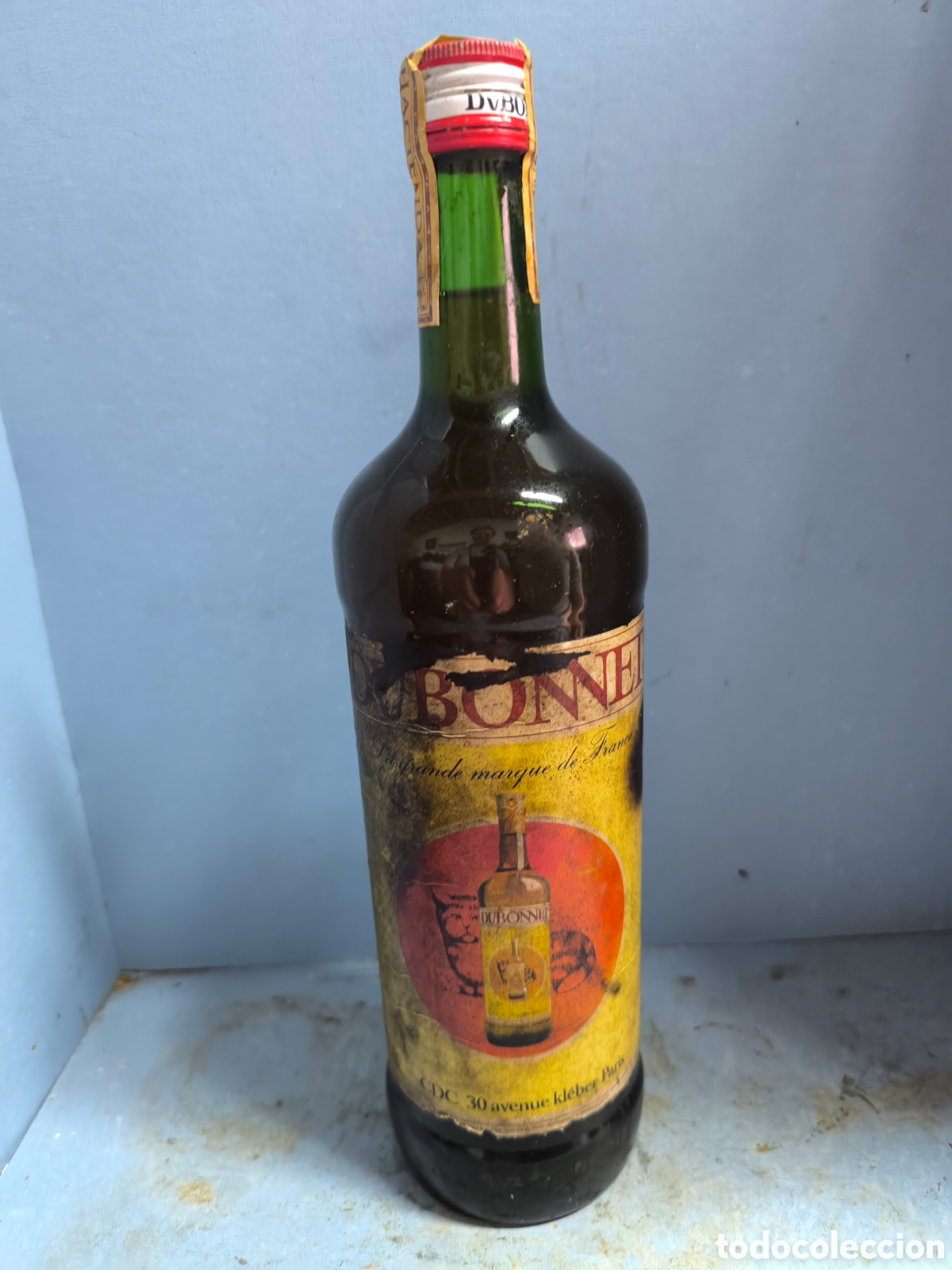 Botellas antiguas: Licor DUBONNET precinto 4 pesetas - Foto 1