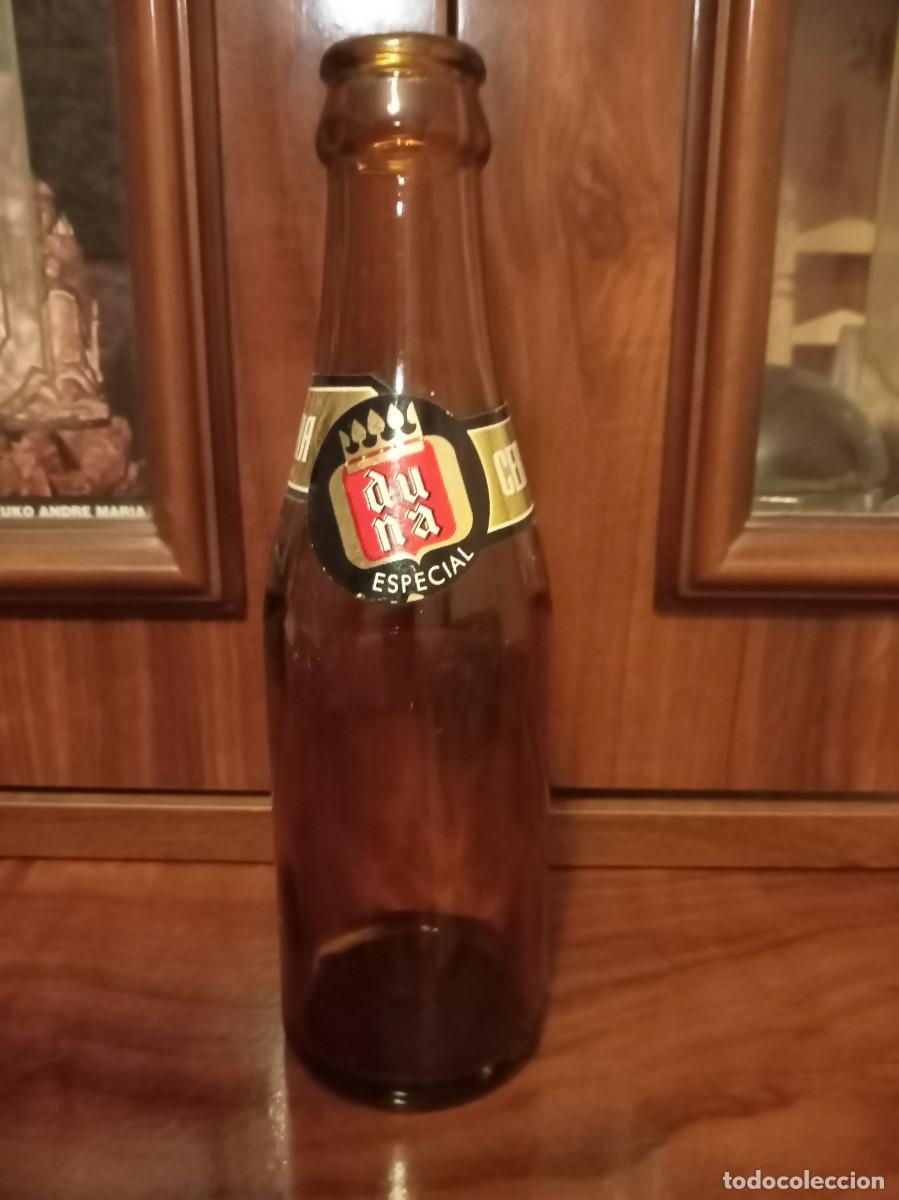 Botellas antiguas: Botella cerveza duna especial 1/5