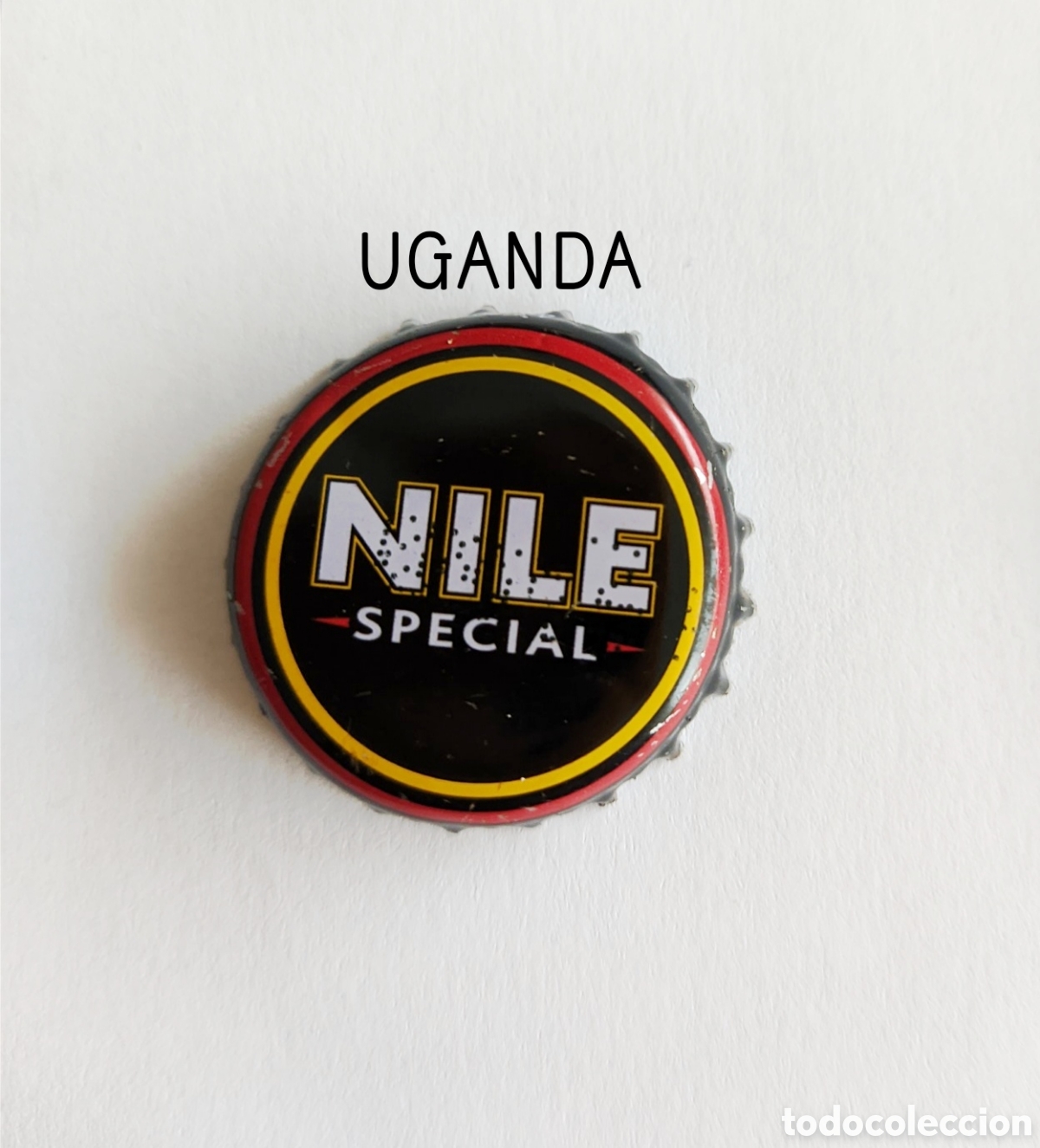 Botellas antiguas: Chapa tap&oacute;n corona de Uganda - Foto 1
