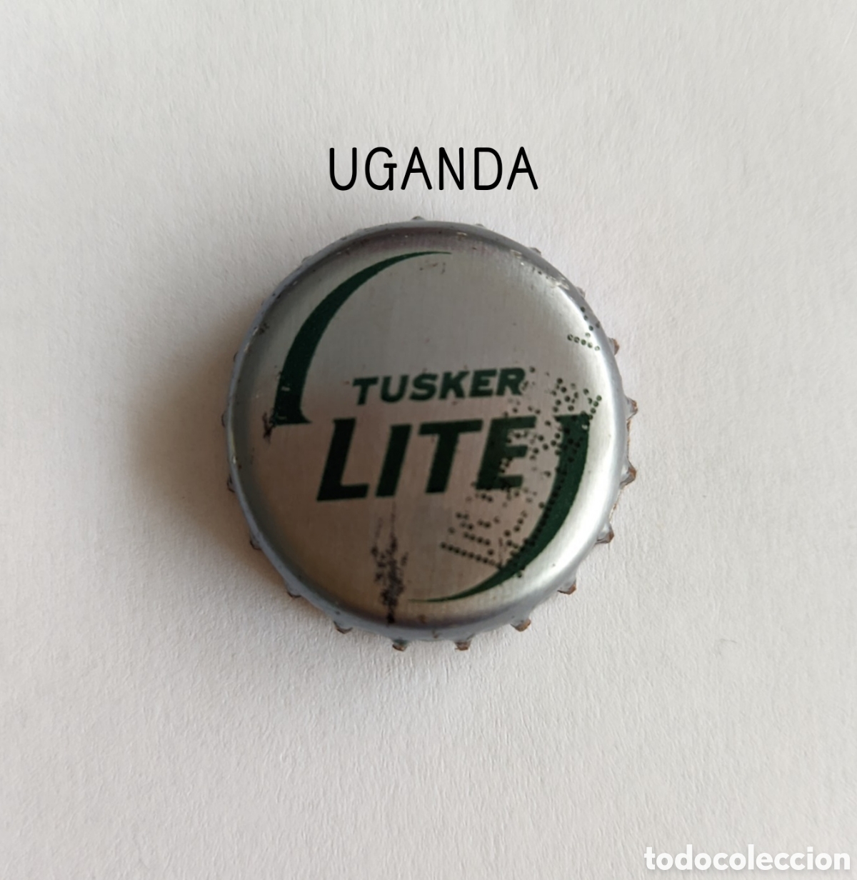 Botellas antiguas: Chapa tap&oacute;n corona de Uganda - Foto 1