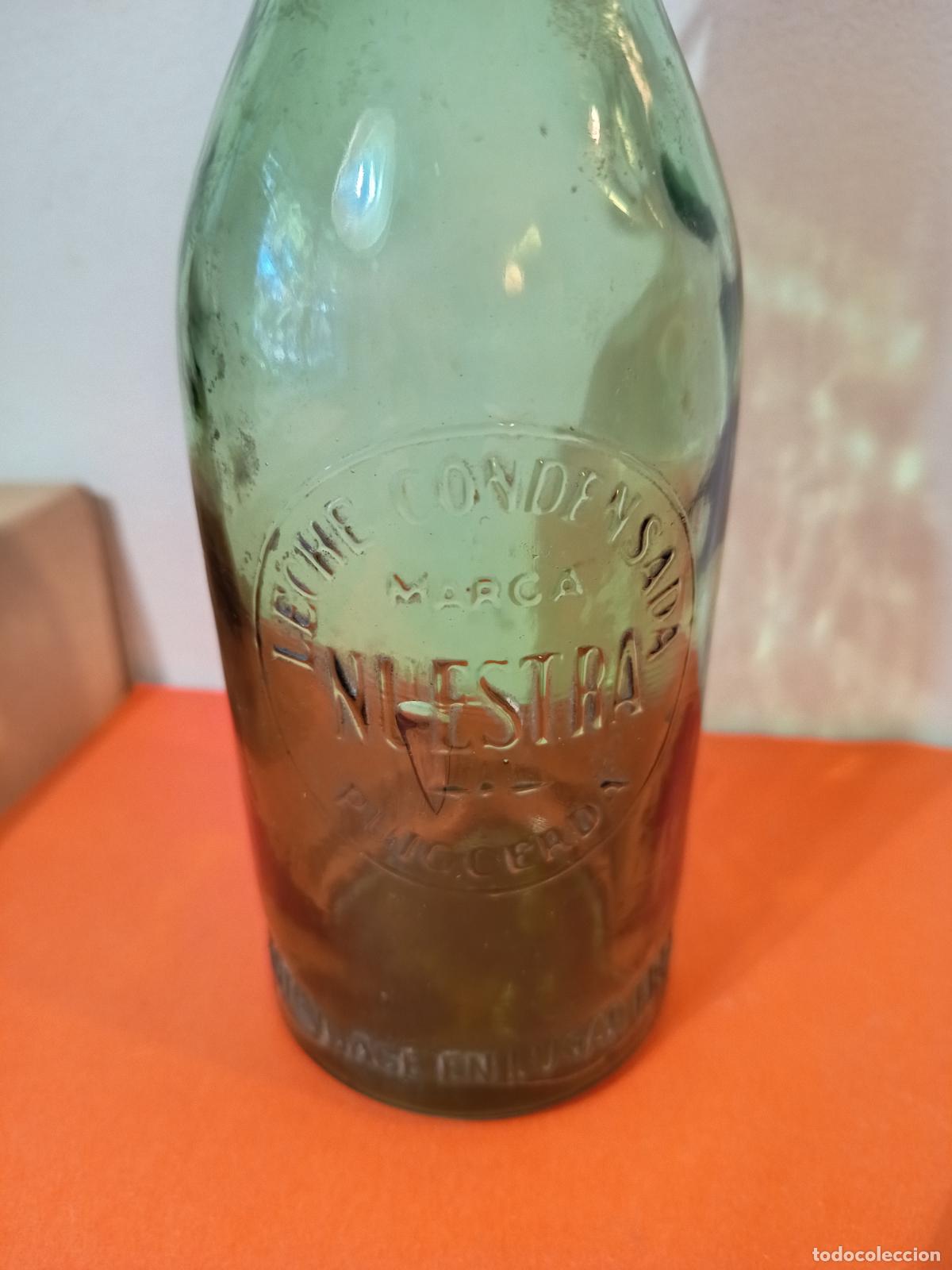 Botellas antiguas: BOTELLA DE LECHE CONDENSADA MARCA NUESTRA PUIGCERDA - Foto 4