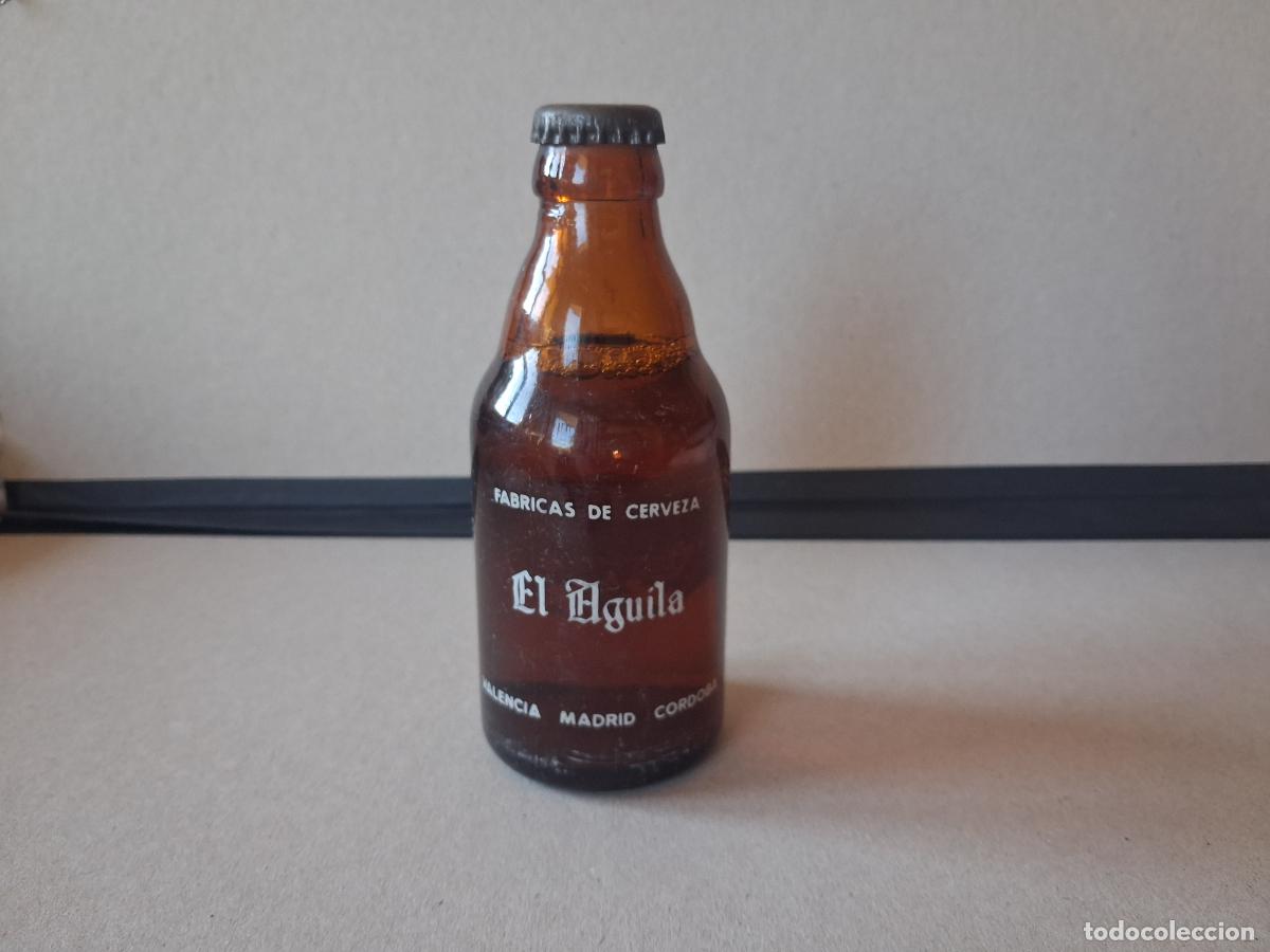 Botellas antiguas: Cerveza el &aacute;guila sin abrir