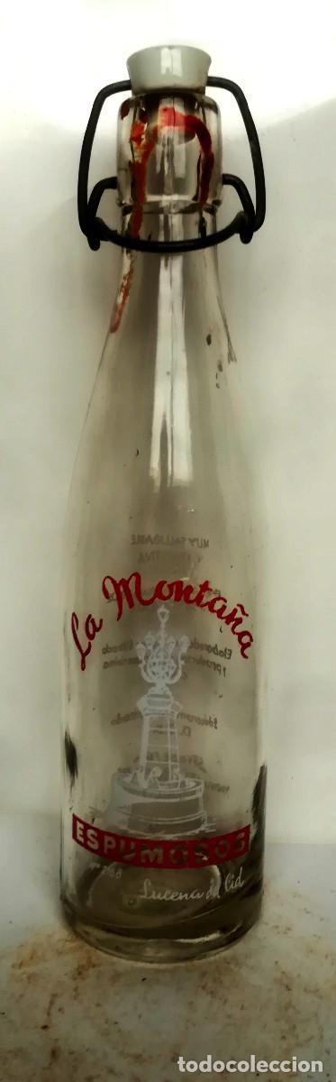 Botellas antiguas: Botell&iacute;n de gaseosa La Monta&ntilde;a, (Lucena del Cid, Castell&oacute;n) serigrafia blanca y roja