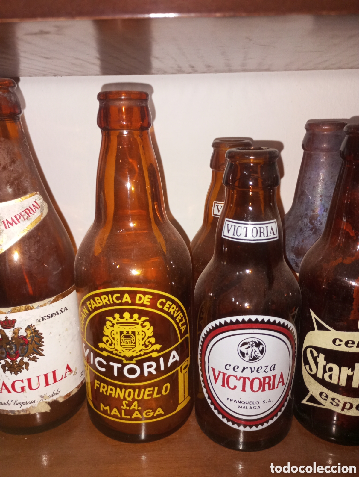 Botellas antiguas: Tercio cerveza Victoria , letras blancas