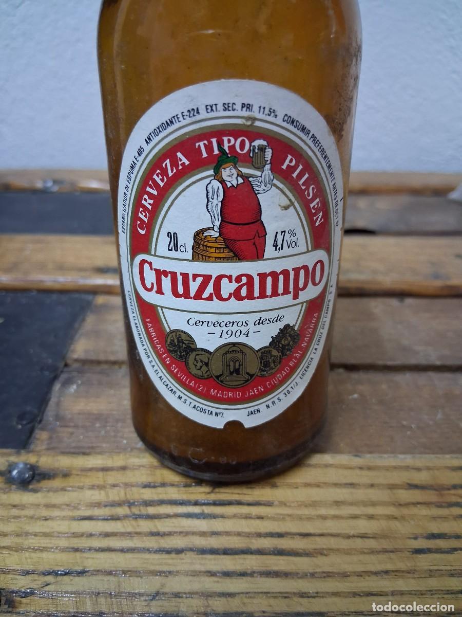 Botellas antiguas: Botella cerveza CRUZCAMPO ALCAZAR fabrica Sevilla Madrid Ja&eacute;n Ciudad Real 92 1992 etiqueta quinto