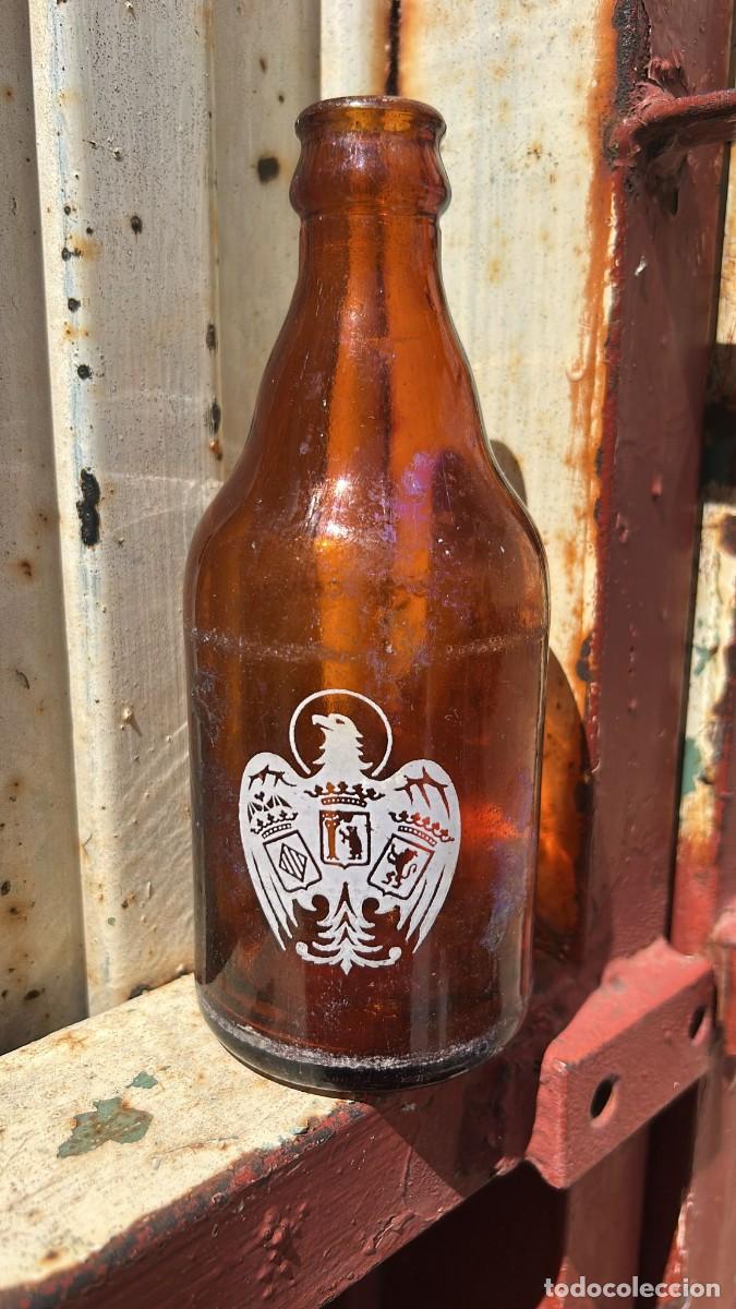 Botellas antiguas: BOTELLA ANTIGUA DE CERVEZA 1 TERCIO DE FABRICAS DE CERVEZA EL AGUILA