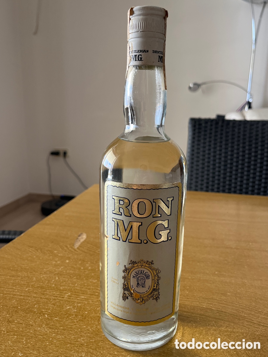 Botellas antiguas: RON M.G. - D&Eacute;CADA A&Ntilde;OS 79