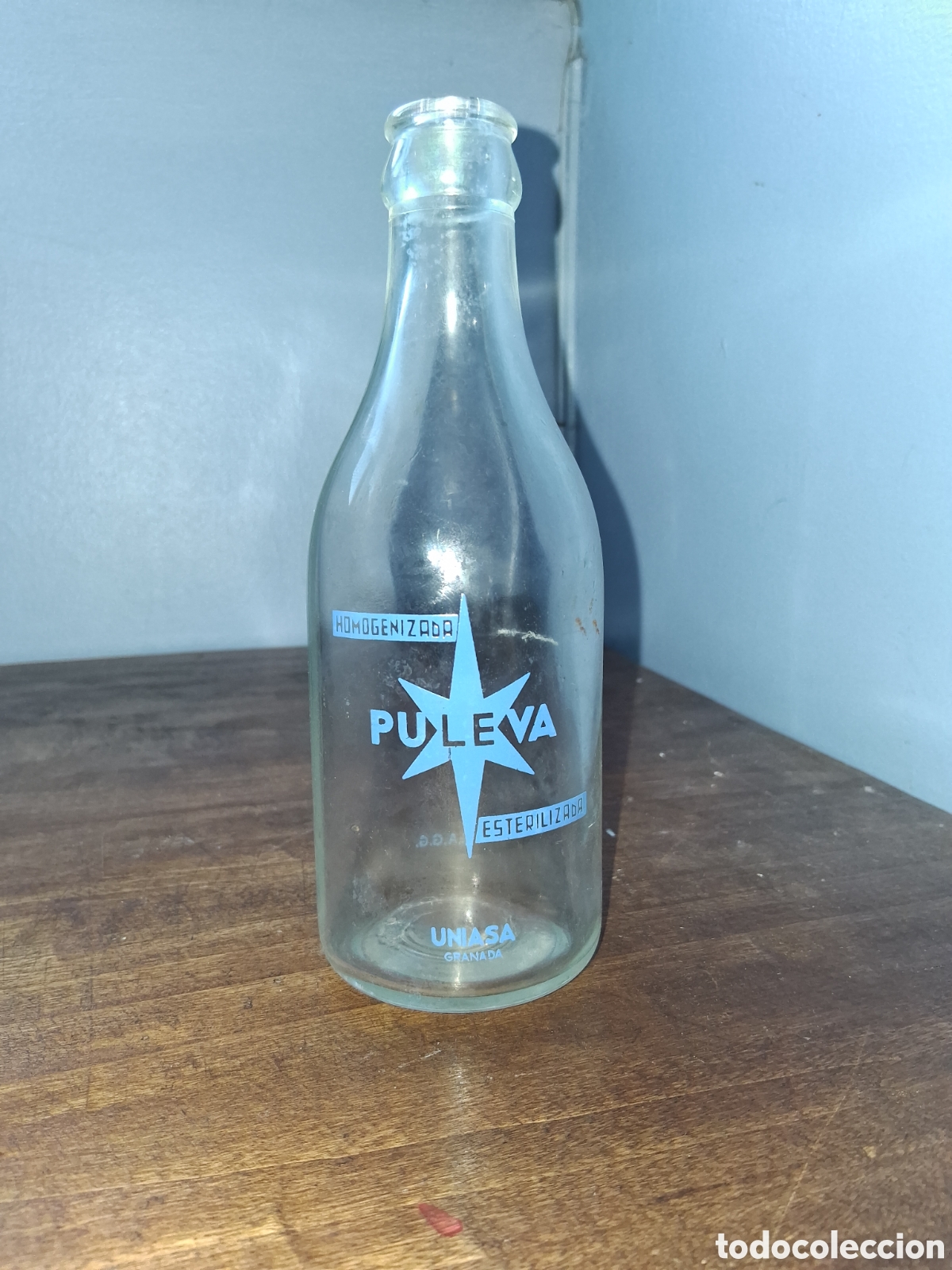 Botellas antiguas: Botella de leche Puleva 25 cl Uniasa Granada