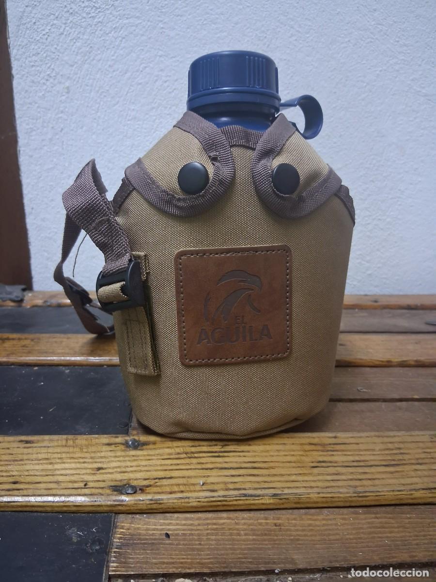 Botellas antiguas: Botella cantimplora publicidad cerveza El aguila