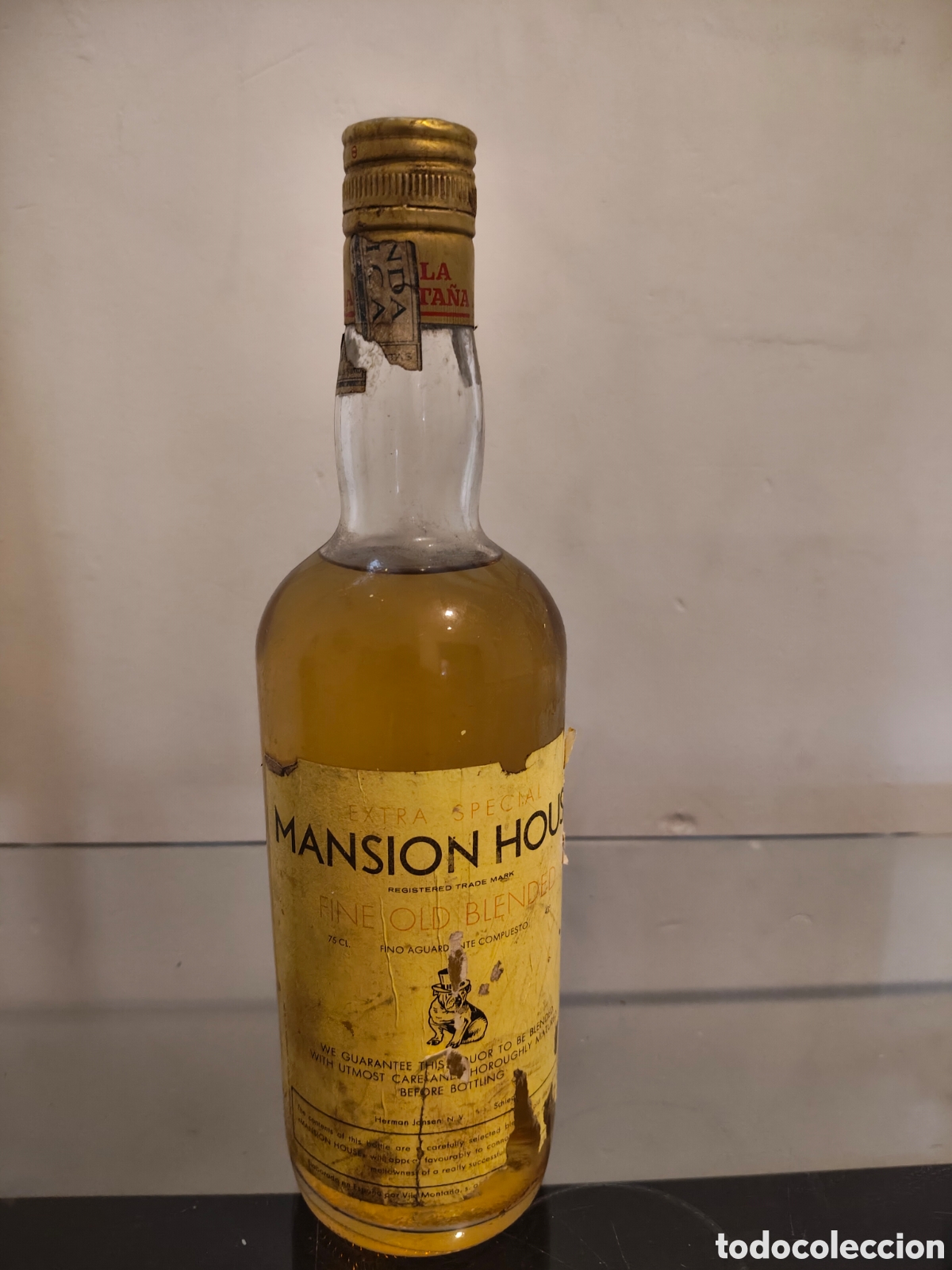 Botellas antiguas: Antigua botella Whisky Mansion House Extra Special Fine Old Blended 75 cl Precintada A&ntilde;os 70