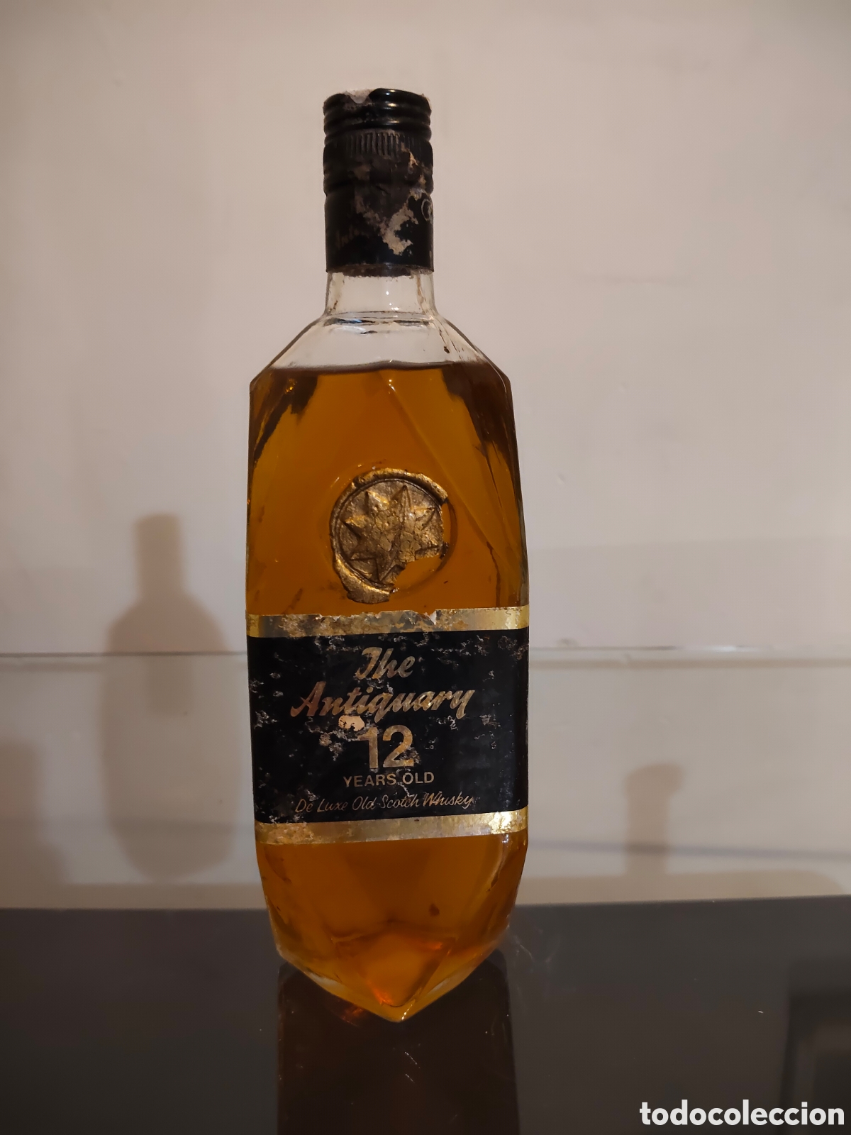 Botellas antiguas: Botella Antigua The Antiquary 12 Years Old Scotch Whisky 75cl. A&ntilde;os 70. Precintada.