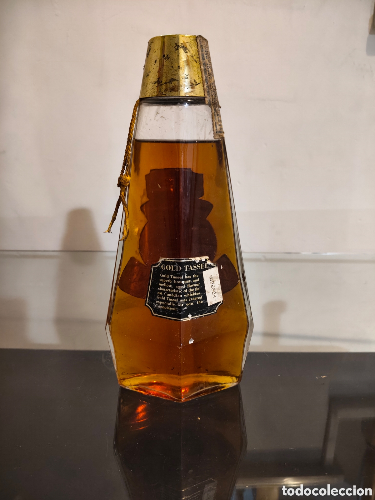 Botellas antiguas: McGuinnes Hold Canadian Whisky 7 years. 710ml. A&ntilde;os 70