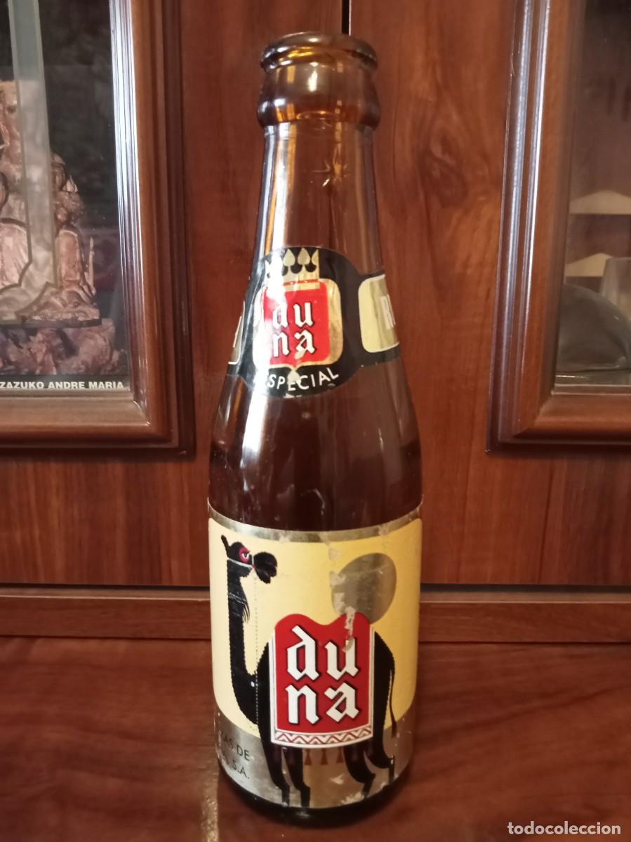 Botellas antiguas: Botella cerveza duna especial 1/5