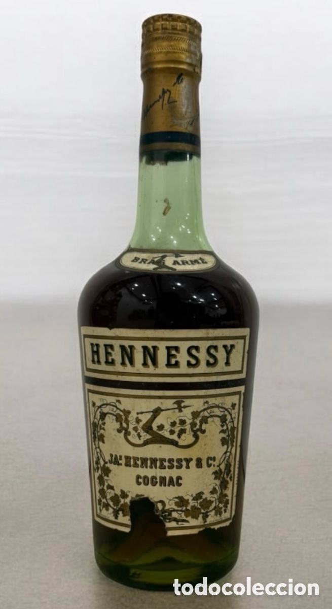 Botellas antiguas: Botella de Cognac Hennessy Bras Arme