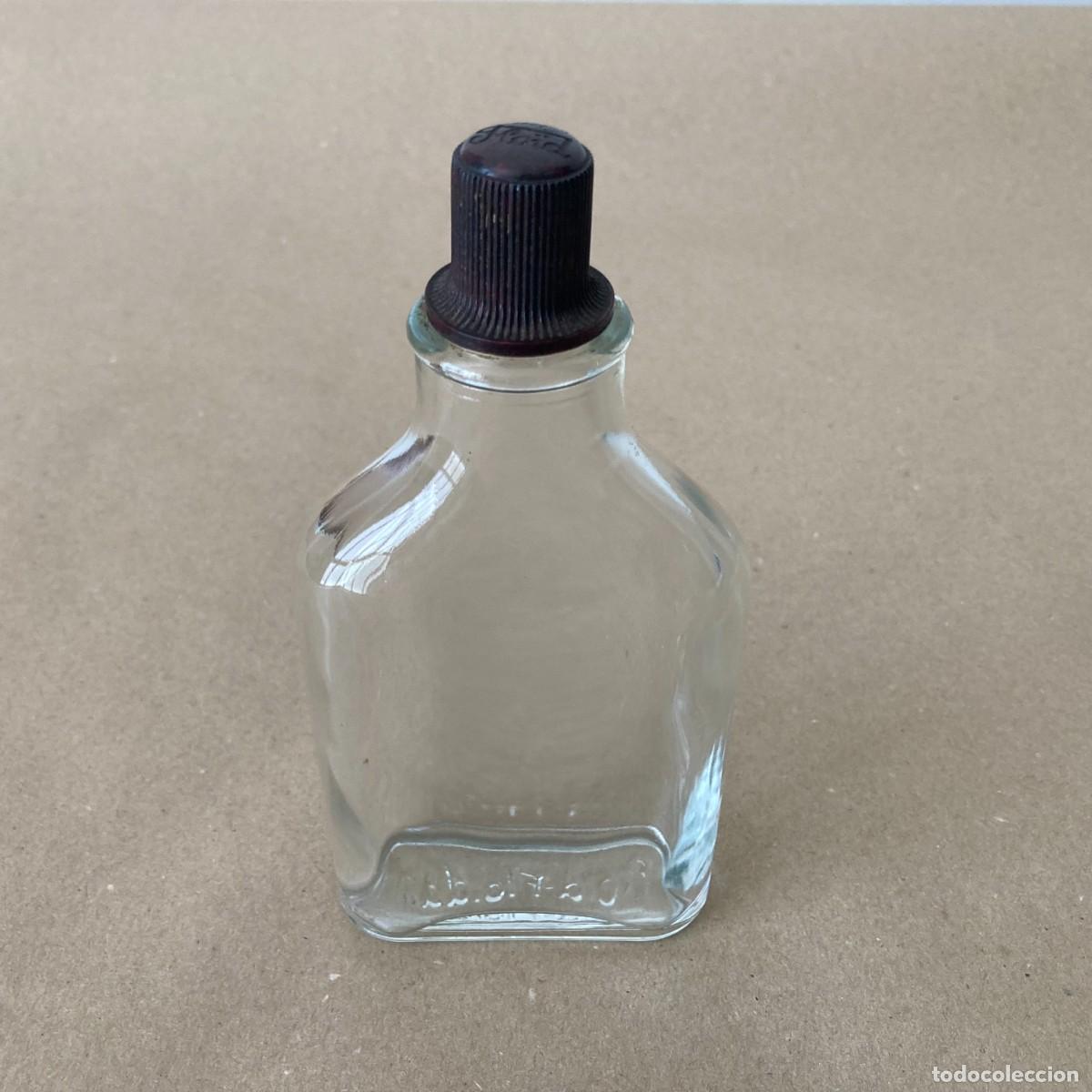 Botellas antiguas: BOTELLA VAC&Iacute;A FLOID VIDRIO CON TAP&Oacute;N