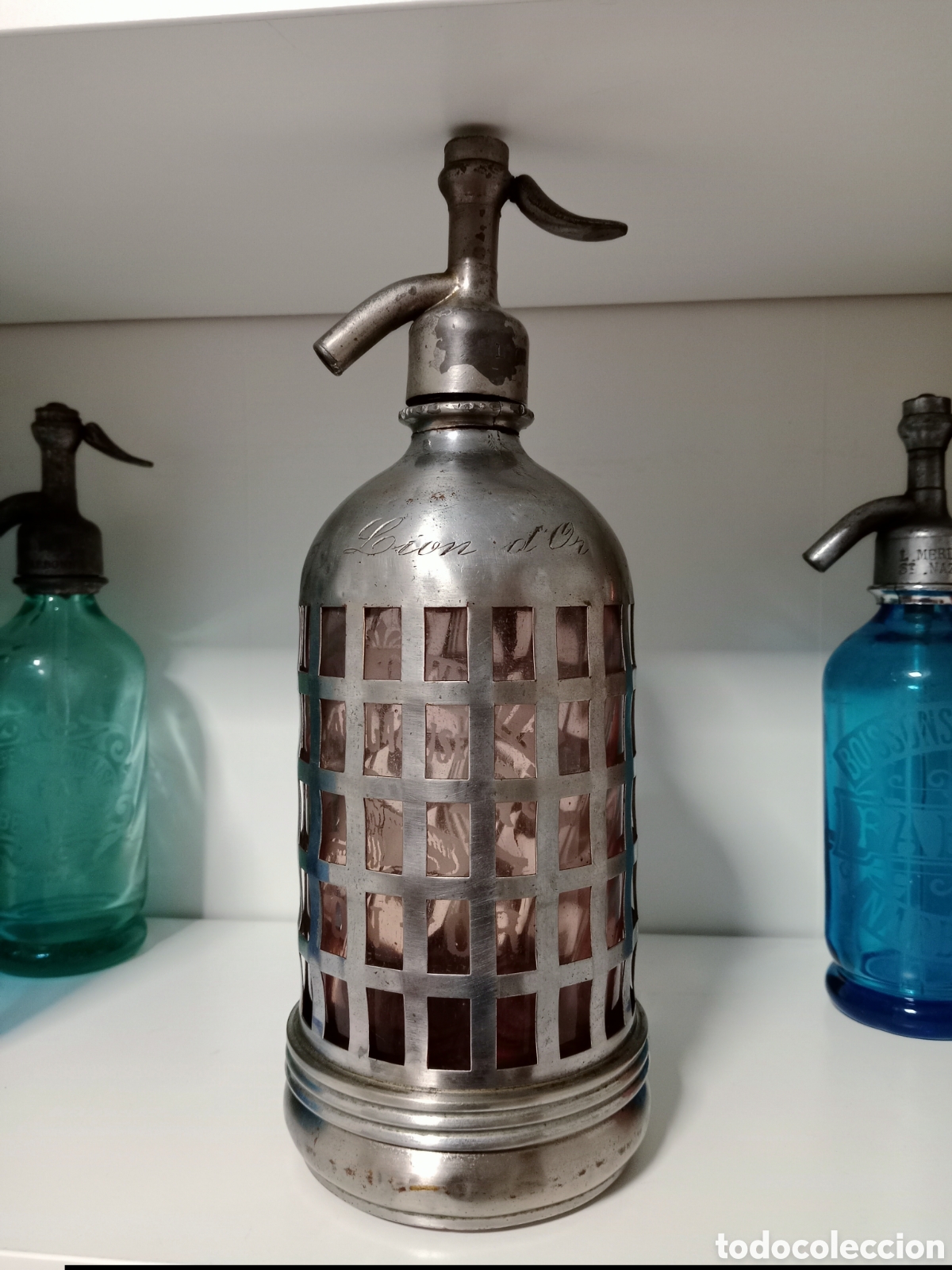 Botellas antiguas: Sif&oacute;n Rosa de Lyon - Par&iacute;s. Escudo del Le&oacute;n. C&aacute;psula Met&aacute;lica con Tap&oacute;n de Plomo Original.