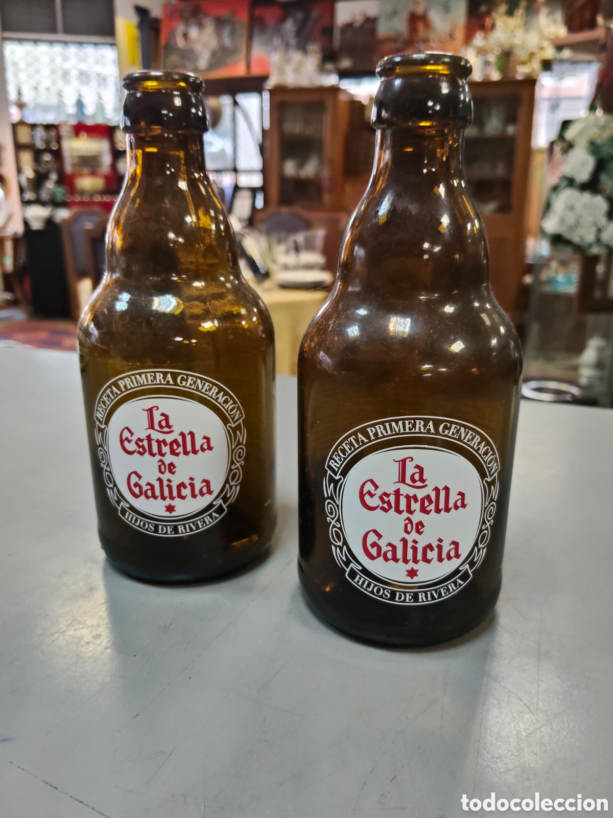 Botellas antiguas: Pareja de botellas vac&iacute;as ESTRELLA GALICIA