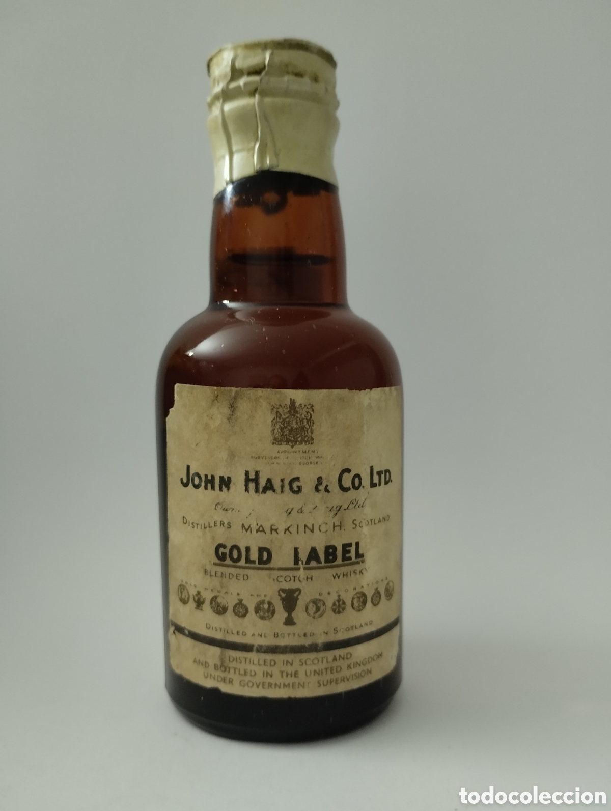 Botellas antiguas: Botellita Haig whisky