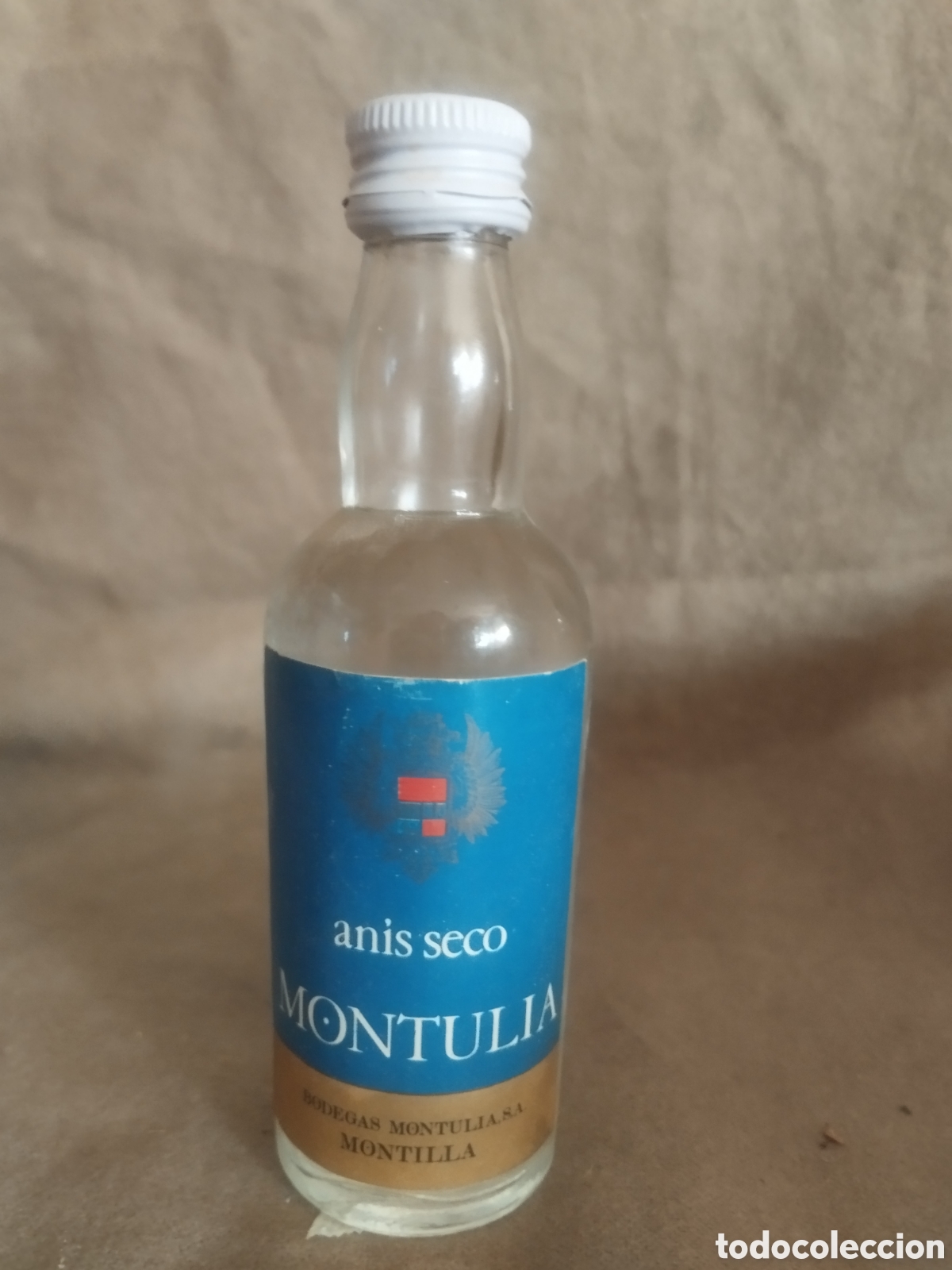 Botellas antiguas: An&iacute;s seco montulia botellin - Foto 1