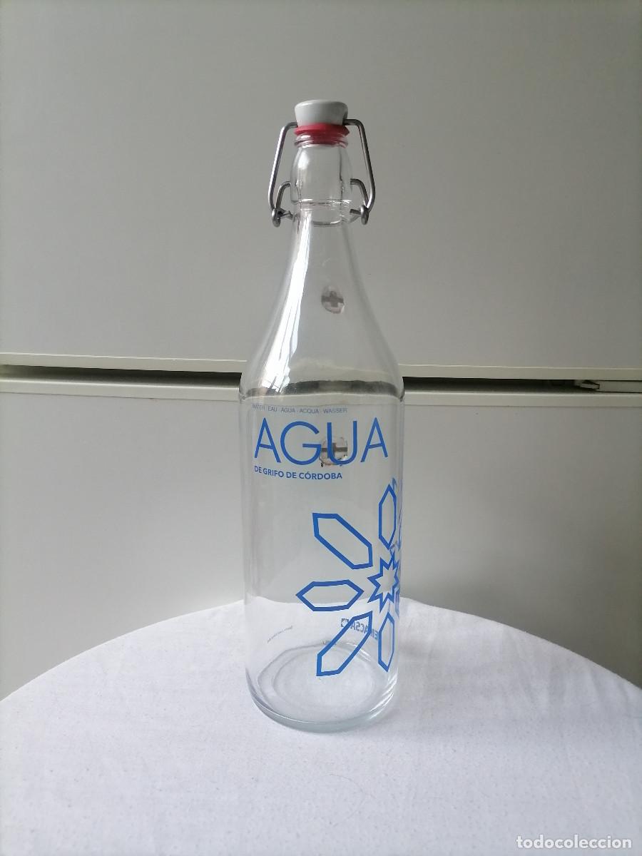Botellas antiguas: Botella de cristal publicitaria Emacsa