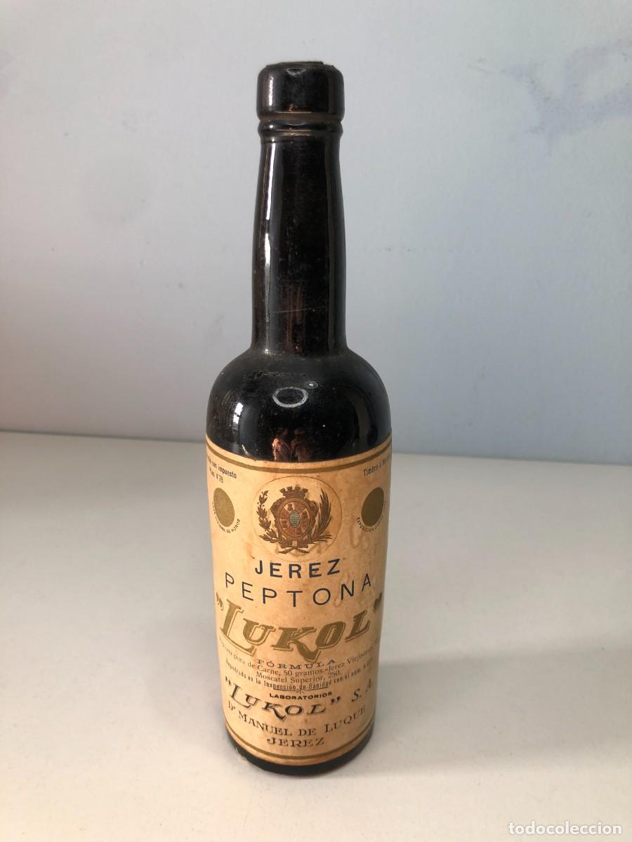 Botellas antiguas: Antigua botella Jerez Peptona Lukol farmacia Dr Manuel de Luque Jerez 1920 etiqueta original