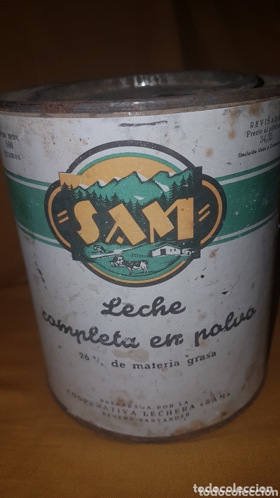 Bo&icirc;tes et petites bo&icirc;tes m&eacute;talliques: Antigua lata leche en polvo Sam 1960