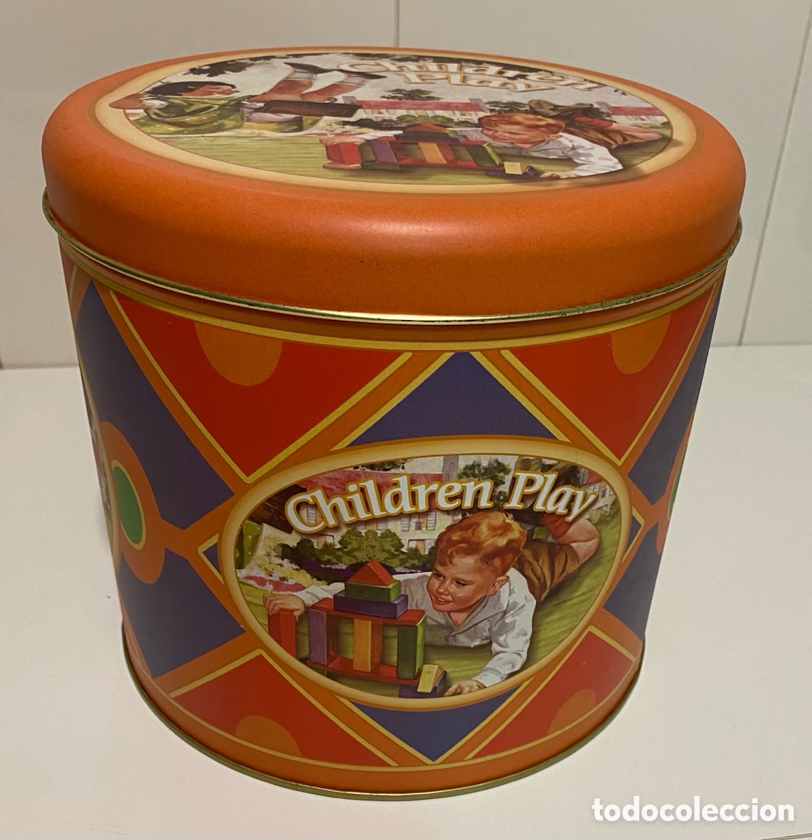Cajas y cajitas met&aacute;licas: Lata decorada de panetonne - Foto 3