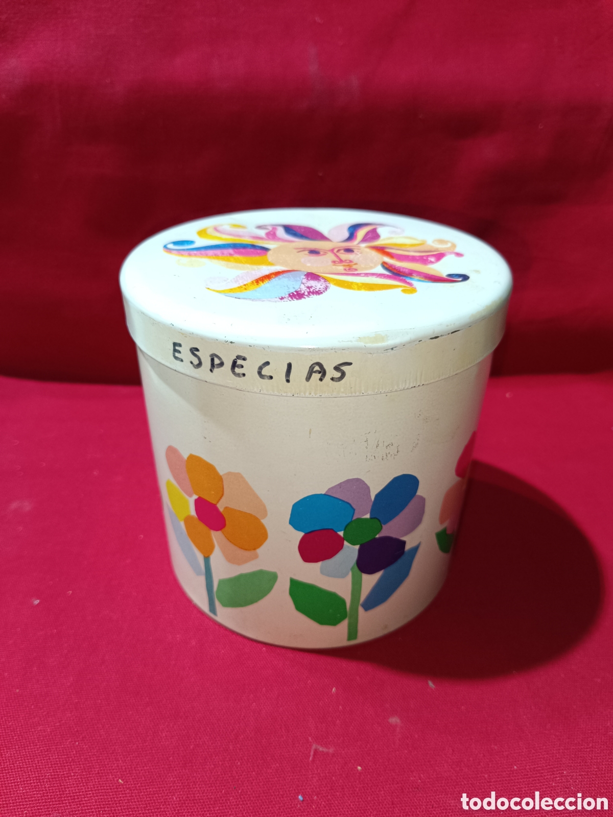 Cajas y cajitas met&aacute;licas: Rara lata bote de colacao cola cao redondo con motivos florales y sol en la tapa