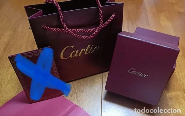 Boxes and metal boxes: Lote Cartier de caja y bolsa sin estrenar