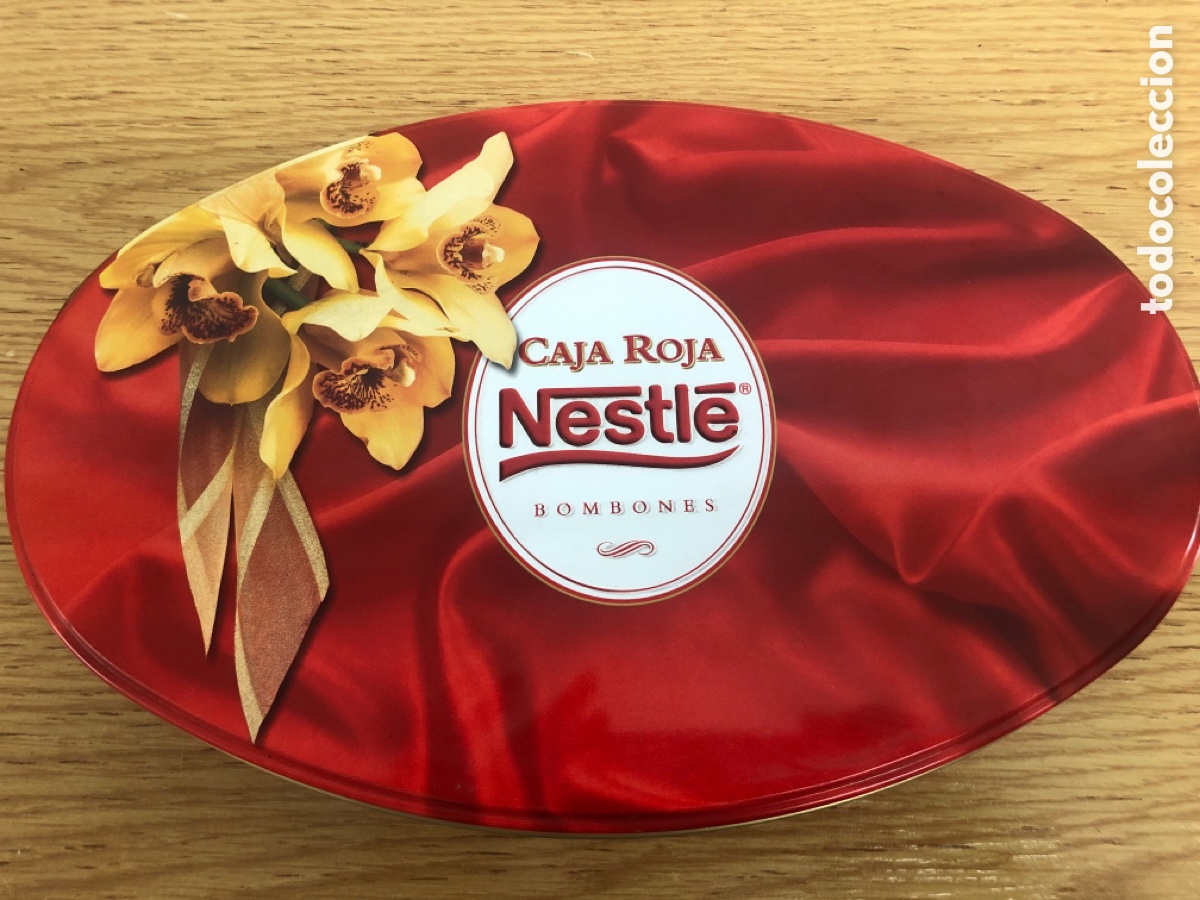 Bo&icirc;tes et petites bo&icirc;tes m&eacute;talliques: Caja roja Nestl&eacute; ovalada a&ntilde;o 2000