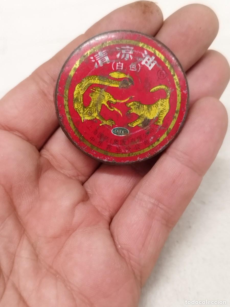 Casse e cassette metalliche: Antigua lata china de alg&uacute;n b&aacute;lsamo chino a identificar.
