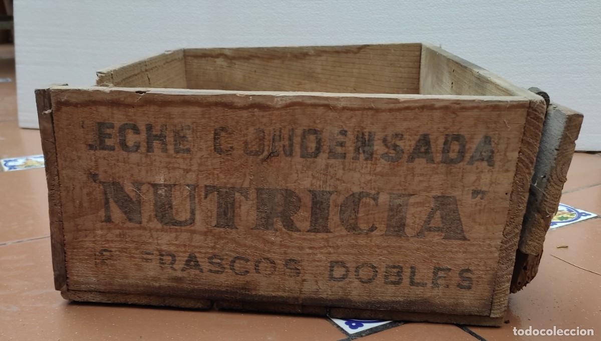 Cajas y cajitas met&aacute;licas: antigua caja de madera leche condensada nutricia- 12 frascos dobles