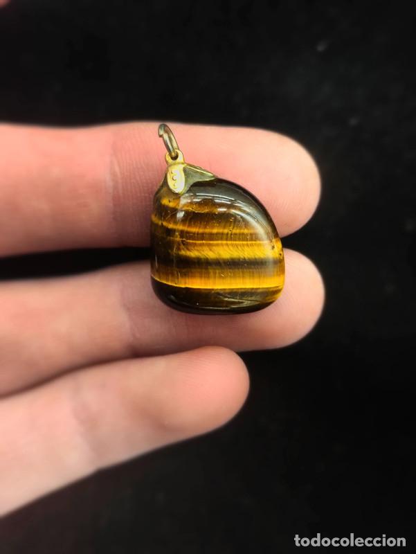 Photo camera: Colgante de Ojo de tigre mineral pulido