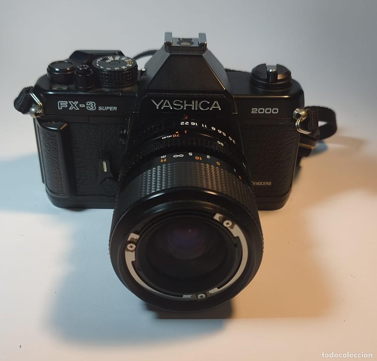 Photo camera: Yashica FX-3 Super 2000 + Objetivo Yashica ML Zoom 35-70mm f/3.5-4.8 + Funda y Manuales Originales