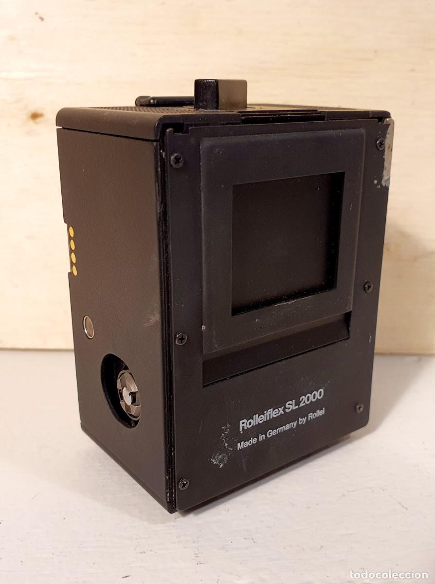 C&aacute;mara de fotos: Rolleiflex SL 2000 film back magazine. 1980.