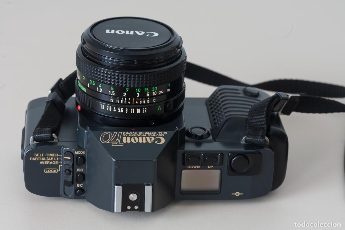 Photo camera: C&aacute;mara r&eacute;flex Canon T70 Multiple program AE Dual Metering System + Objetivo Canon lens FD 50 mm. 1
