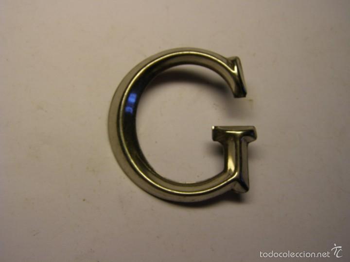 Affiches: Letra met&aacute;lica G para poner inscripciones sobre piedra, madera, o metal.