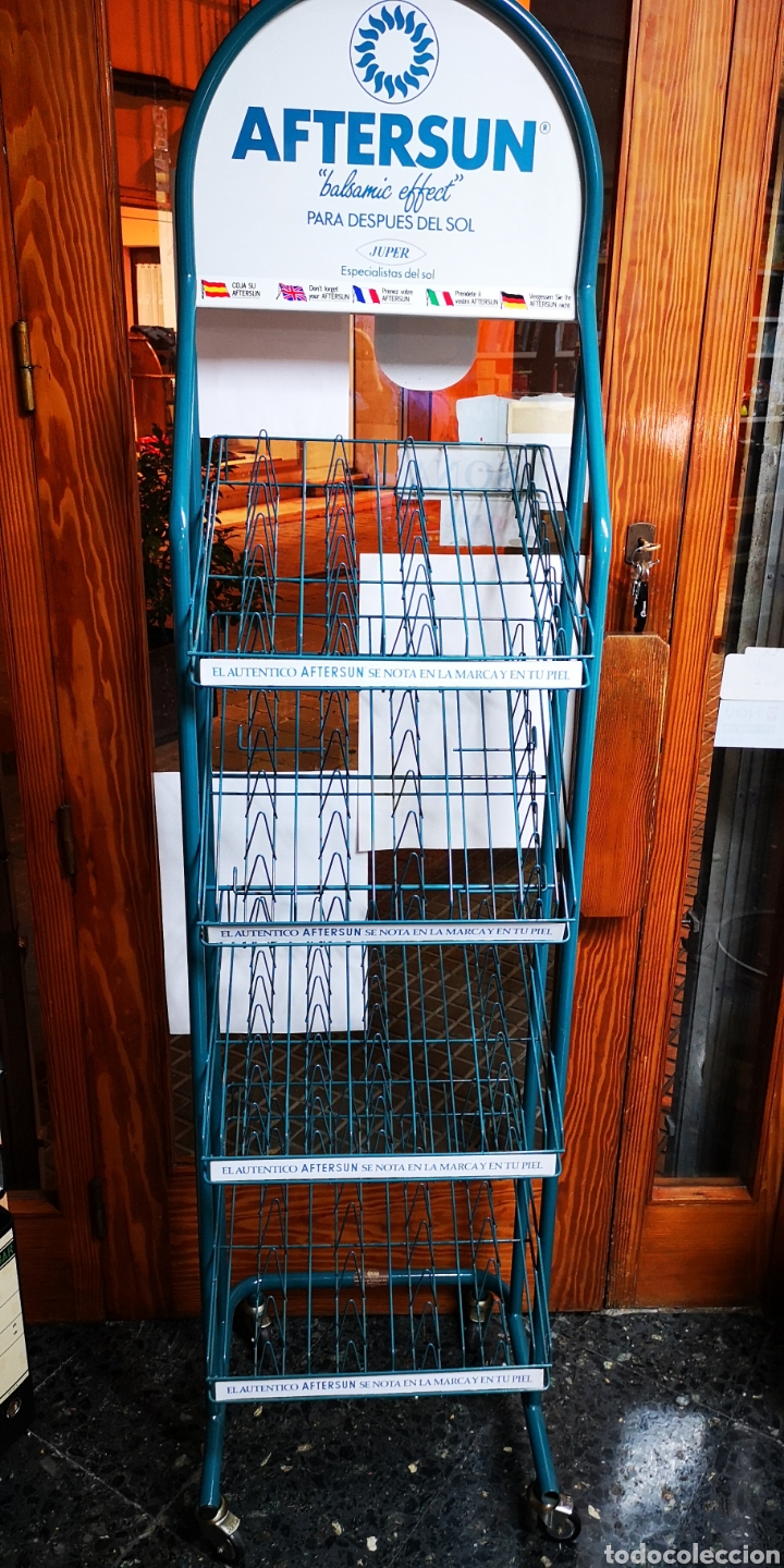 Affiches: Expositor metalico con ruedas giratorio aftersun a estrenar