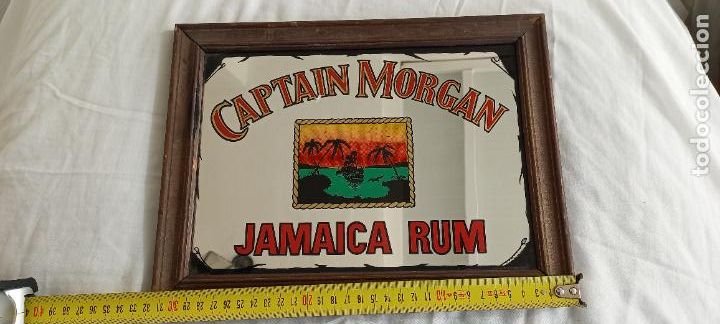 Plakate: RON CAPTAIN MORGAN JAMAICA RUM. CUADRO ESPEJO CARTEL PUBLICITARIO. 31,5 x 24 cm.