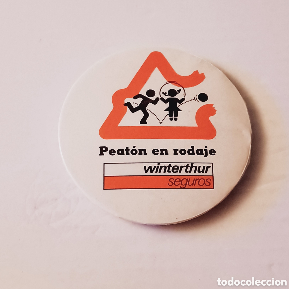 Plakate: Chapa imperdible a&ntilde;os 90 seguros winterthur peat&oacute;n en rodaje 6 cm diametro