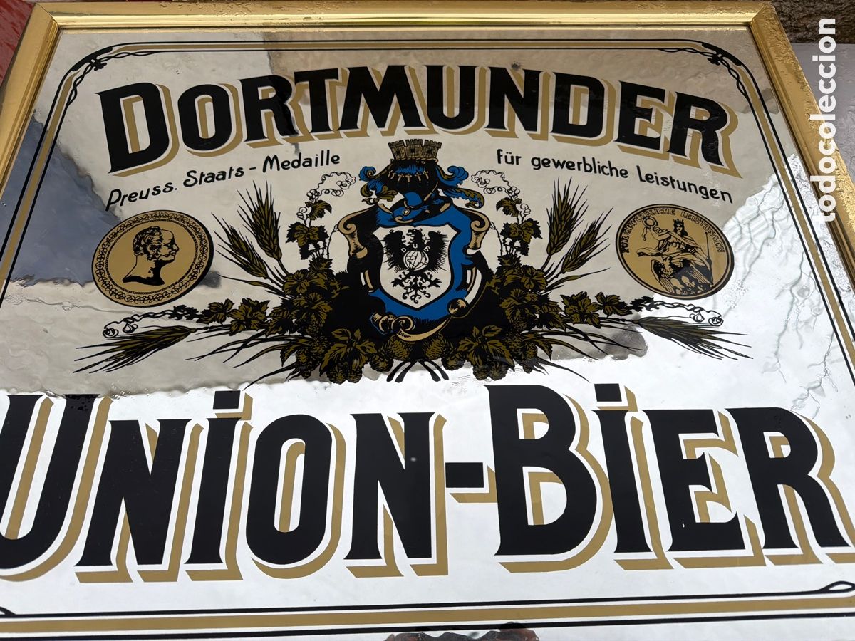 Carteles: Espejo publicitario cerveza