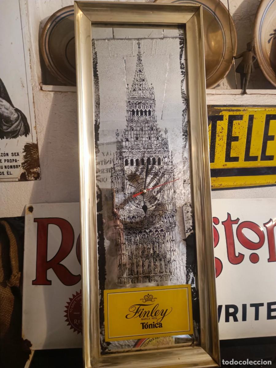 Carteles: Reloj t&oacute;nica finley funcionando