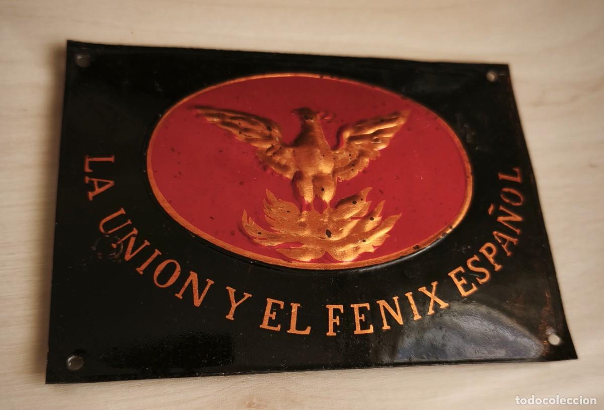 Carteles: Chapa lacada o similar de buz&oacute;n o portero autom&aacute;tico de la Uni&oacute;n y El Fenix Espa&ntilde;ol. 7 x 10 cms.