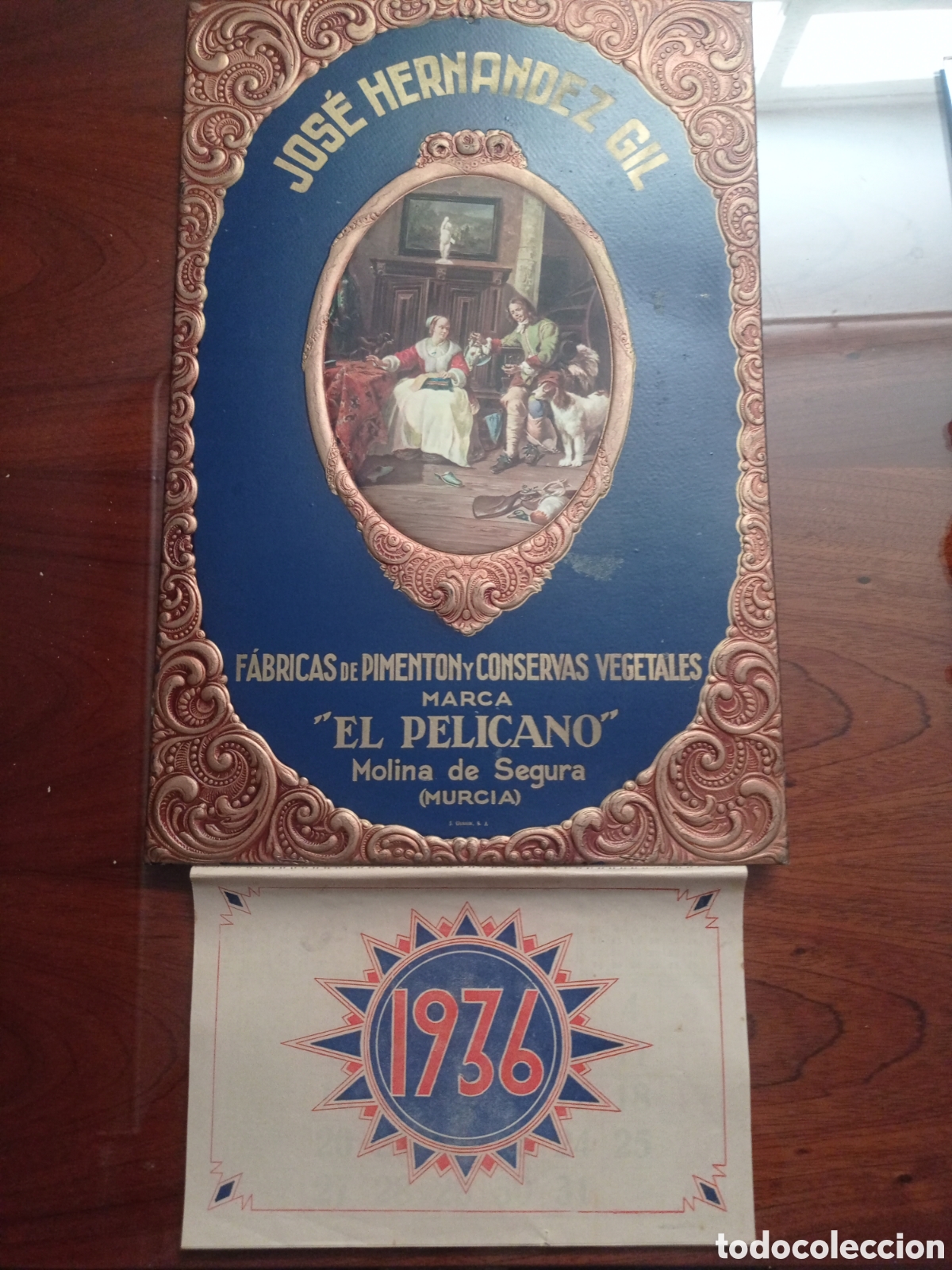 Affissi: &rdquo;Almanaque 1936 Piment&oacute;n El Pel&iacute;cano - Litograf&iacute;a J. Gerzon S.A. - Obra Gabri&euml;l Metsu - TACO COMPLET