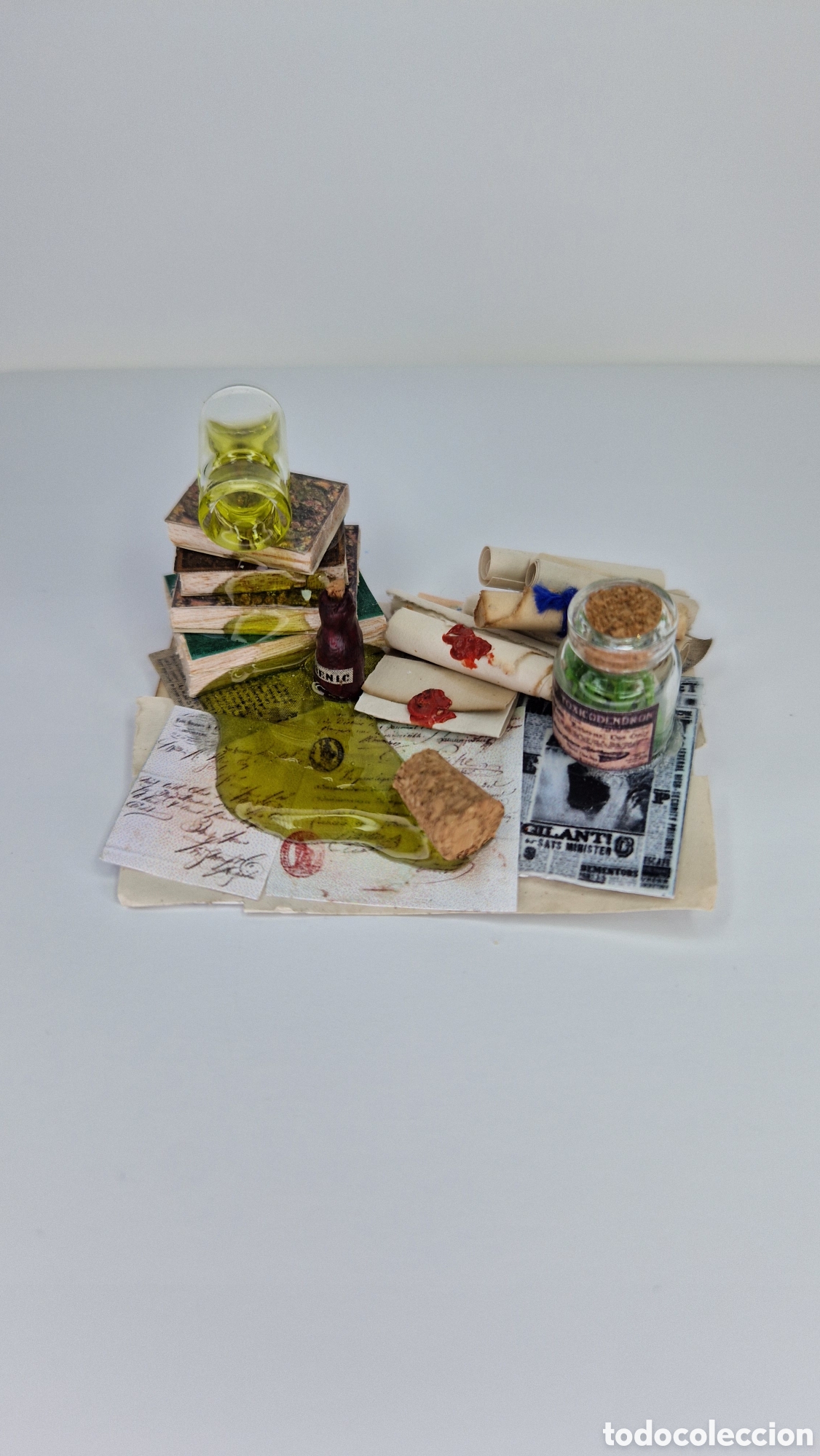Casas de mu&ntilde;ecas: P&oacute;cima derramada miniatuta 1/12